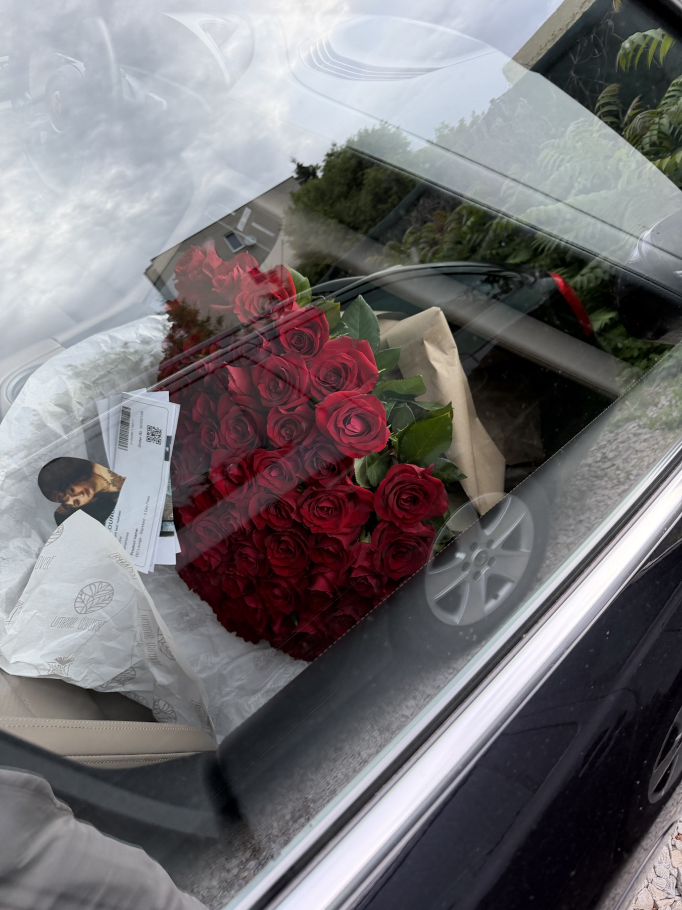 Bouquet of red roses on a car seat